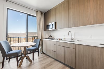 The guest suite offers a quiet table for two with direct access to the balcony and fresh air.