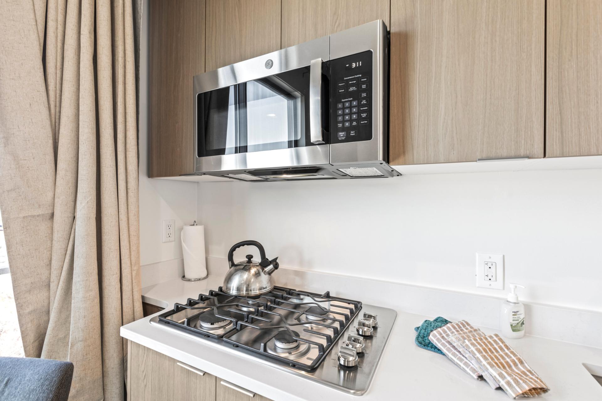 Kitchenette details in this guest suite offer added flexibility for drinks or light snacks.
