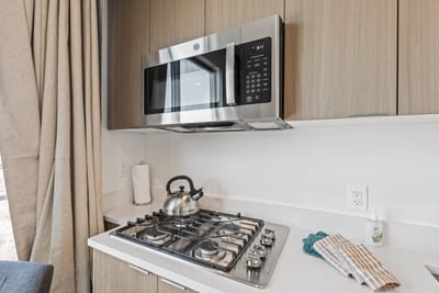 Kitchenette details in this guest suite offer added flexibility for drinks or light snacks.