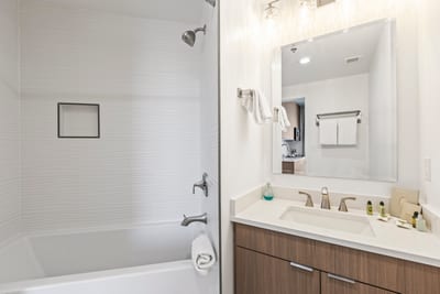 A full guest bathroom with tub and shower combo offers family-friendly flexibility and modern fixtures.