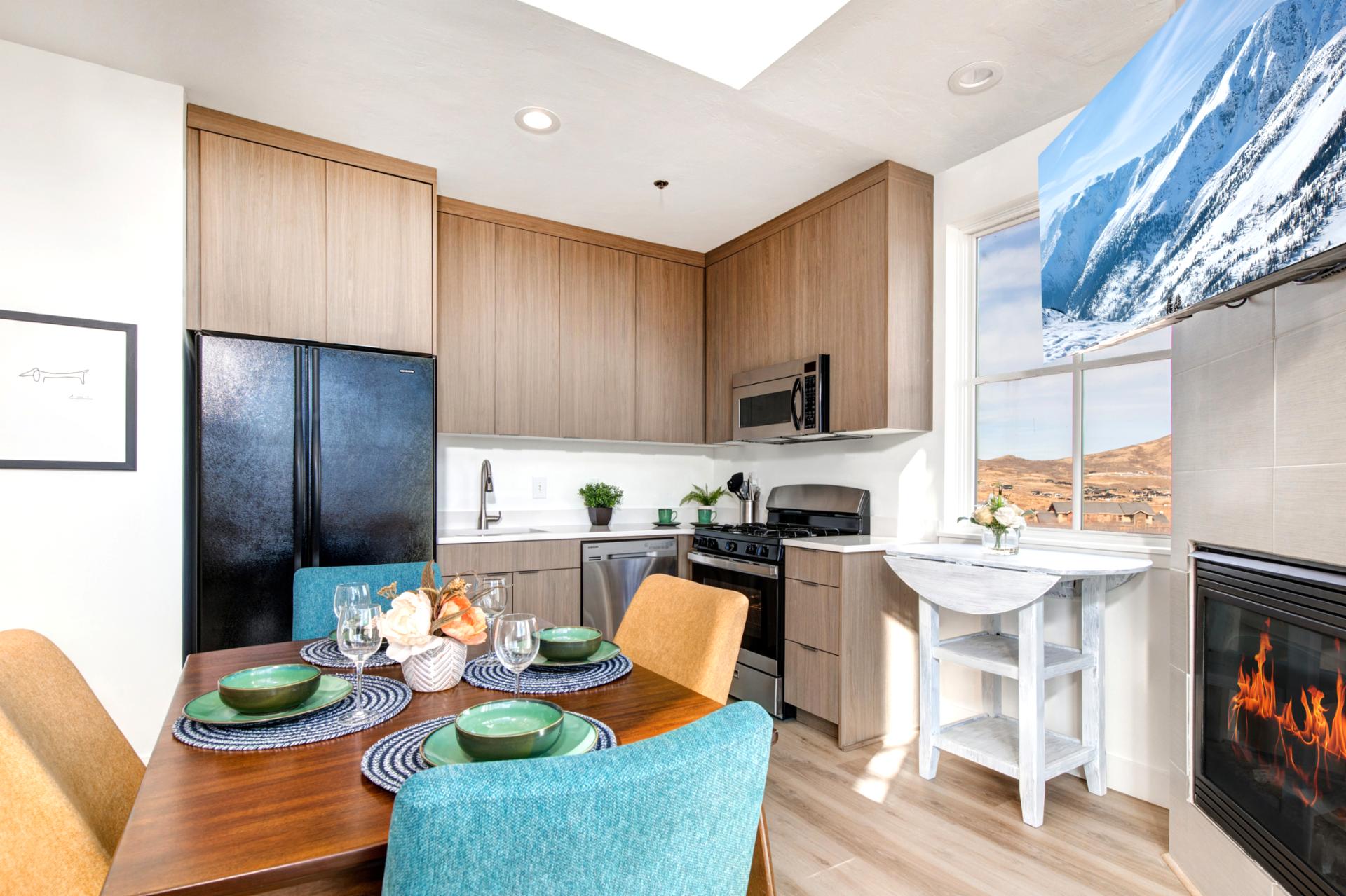 Your modern kitchen features wood cabinetry, granite counters, and a breakfast bar for casual mornings.