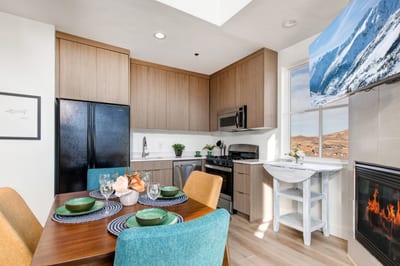 Your modern kitchen features wood cabinetry, granite counters, and a breakfast bar for casual mornings.