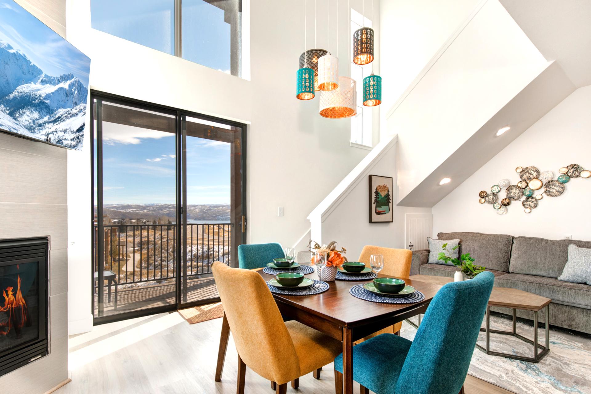 Enjoy meals with a view in your dining area, where floor-to-ceiling windows frame the stunning mountain landscape.