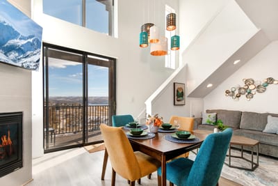 Enjoy meals with a view in your dining area, where floor-to-ceiling windows frame the stunning mountain landscape.