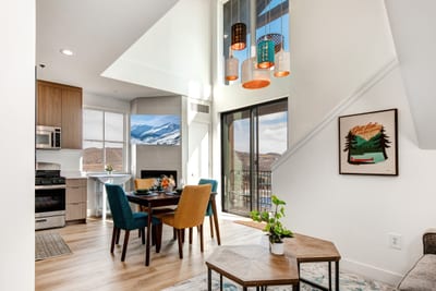 Vaulted ceilings and dramatic light fixtures elevate your dining experience in this airy, open space.