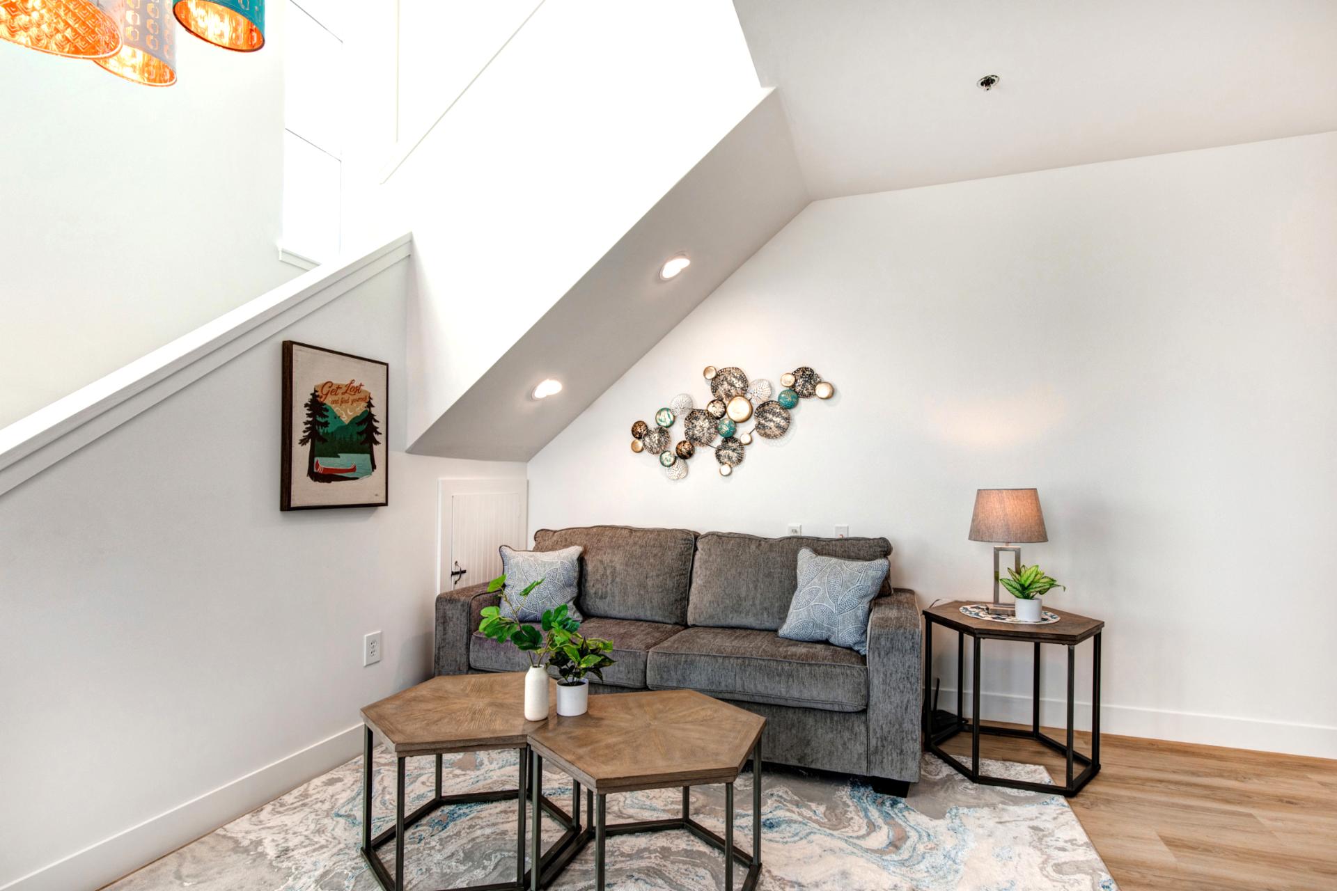 This second seating area offers a cozy spot for conversation, reading, or game night with family.