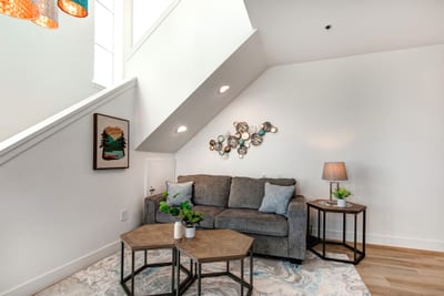 This second seating area offers a cozy spot for conversation, reading, or game night with family.