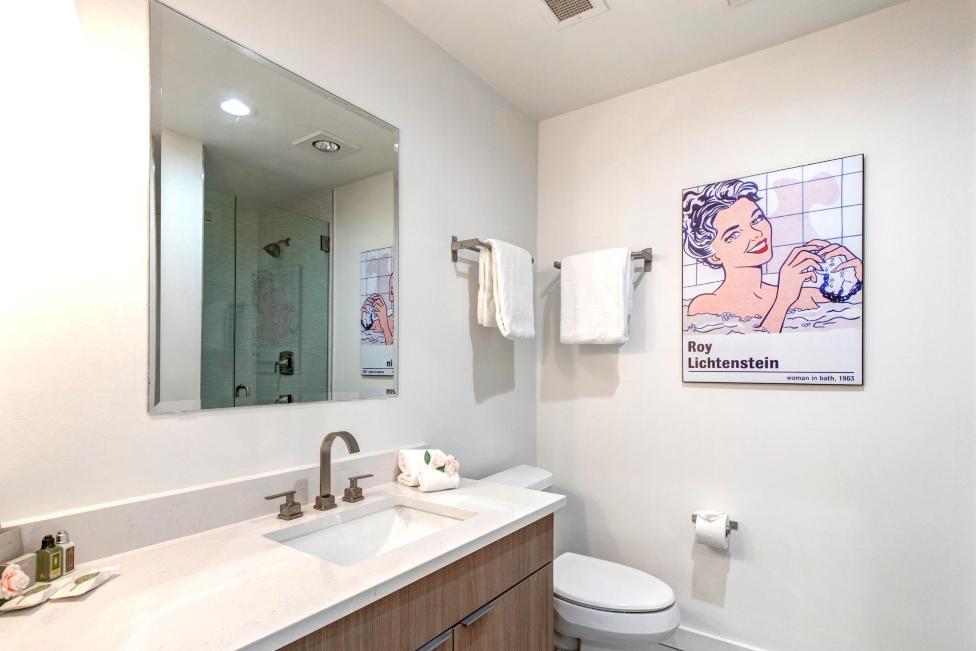 Each guest bath features updated counters, soft towels, and plenty of space to refresh.