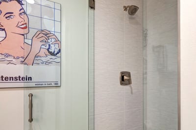 This glass-enclosed walk-in shower is clean, modern, and easy to access.