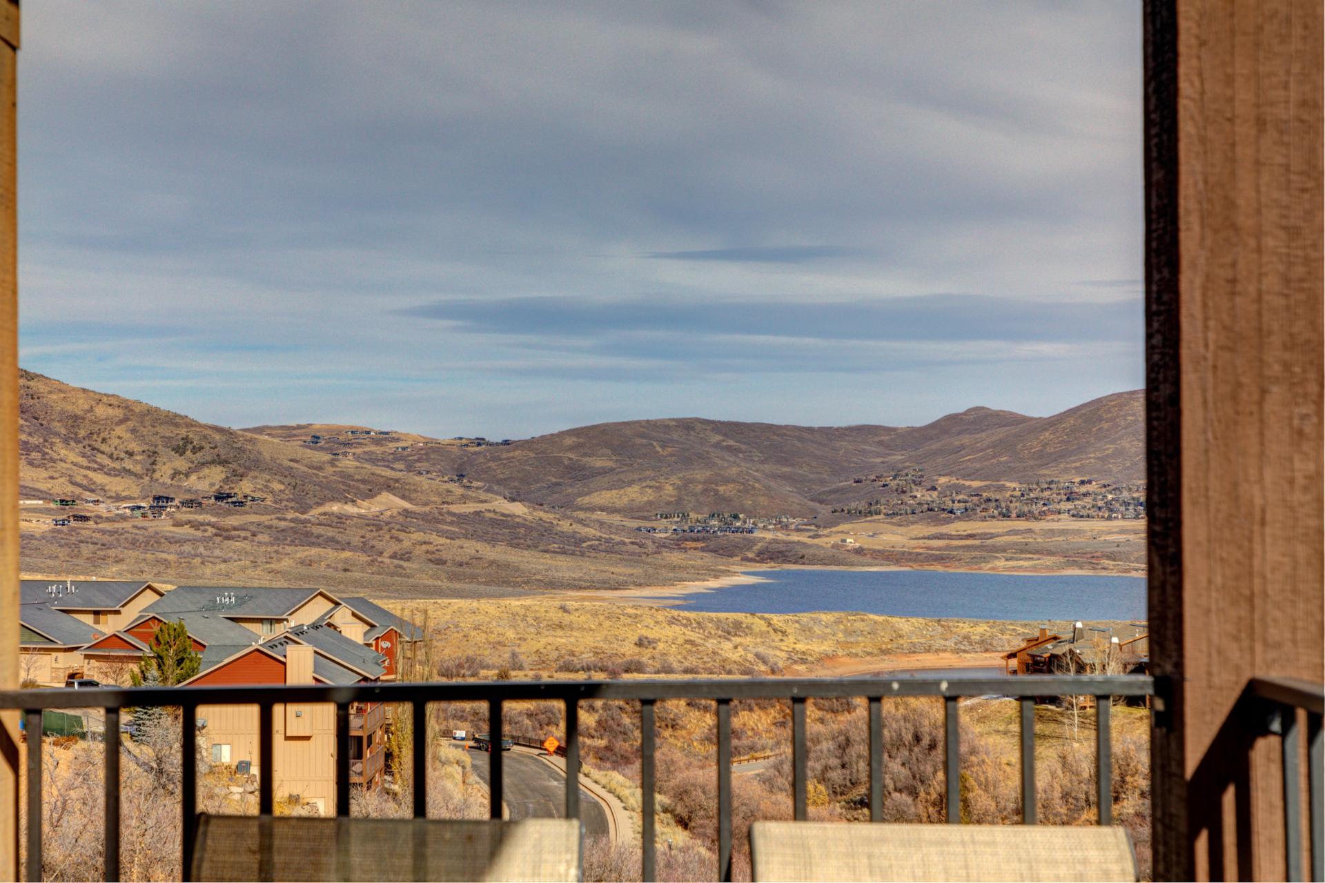 Step onto your balcony for peaceful views of the lake, hills, and surrounding valley.