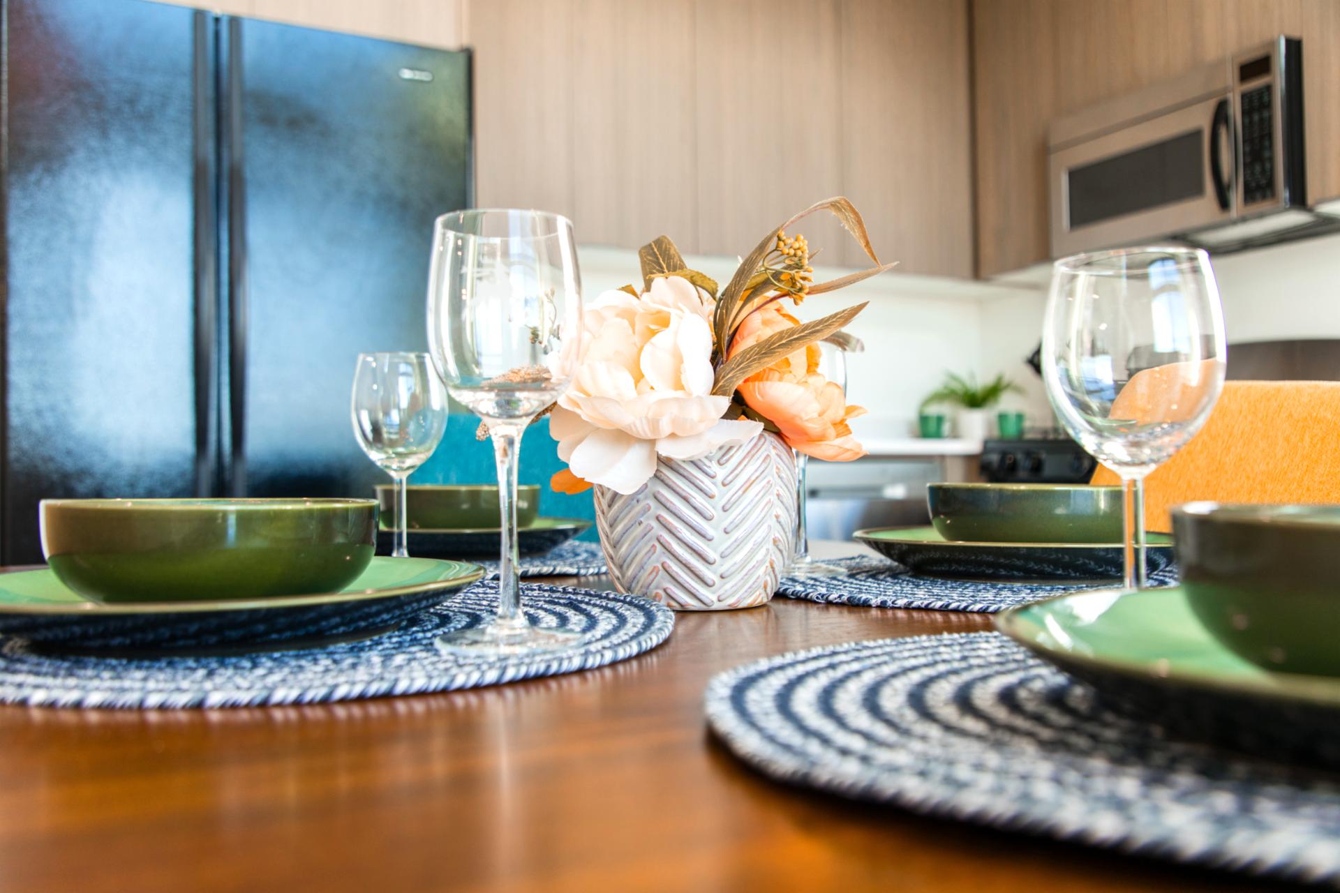 Dine in style with elegant place settings and mountain light pouring in through tall windows.