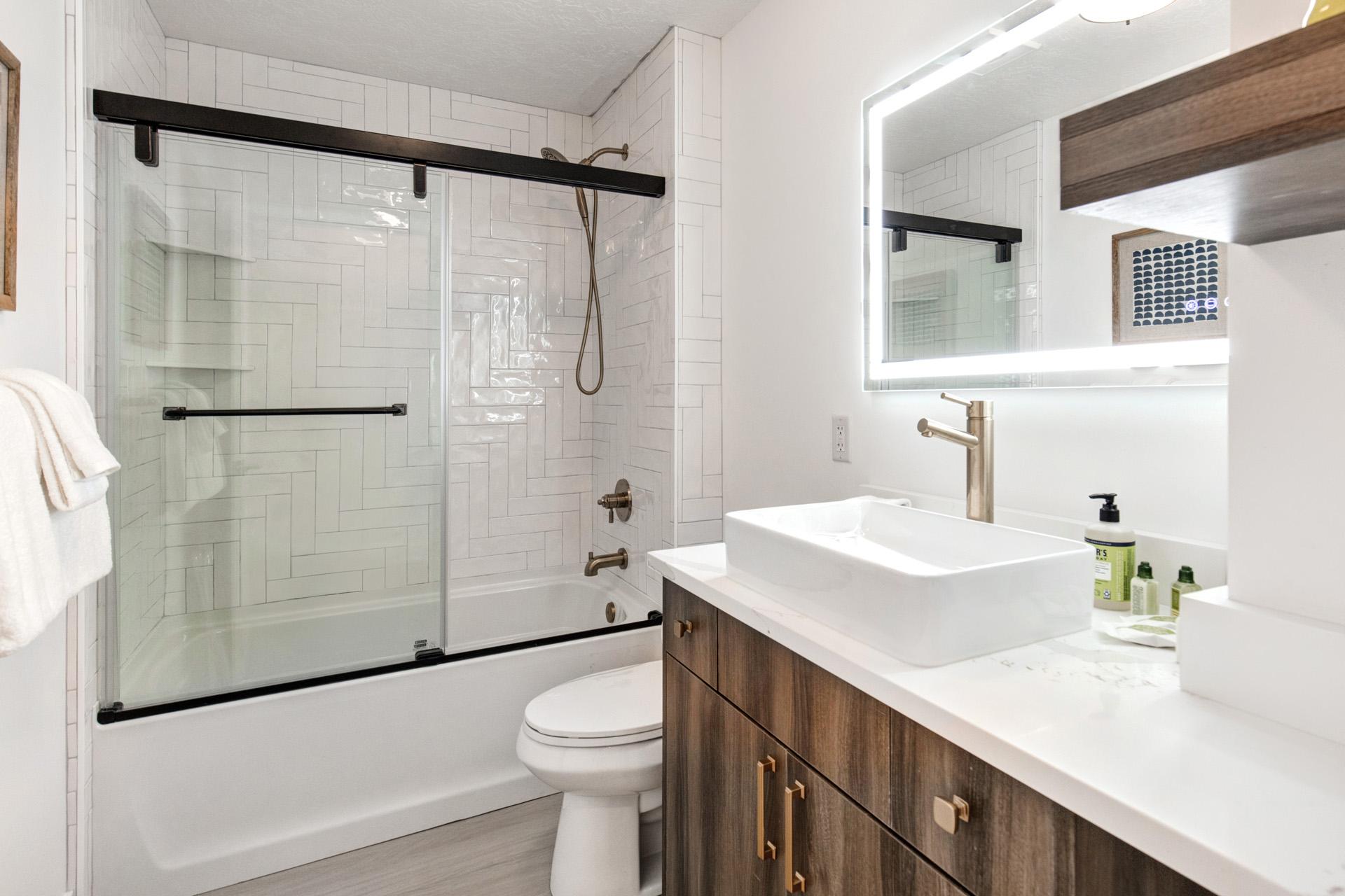 Refresh in your full bath with a combination tub and shower, granite vanity, and L’Occitane amenities.