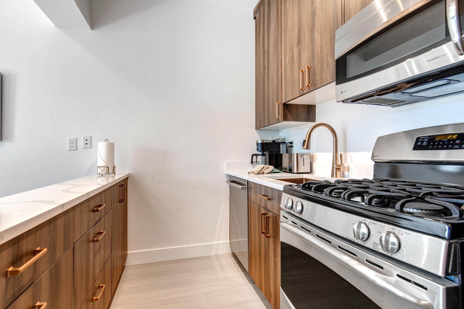 A gas range and full-size fridge give you all the tools for cooking your favorite vacation meals.