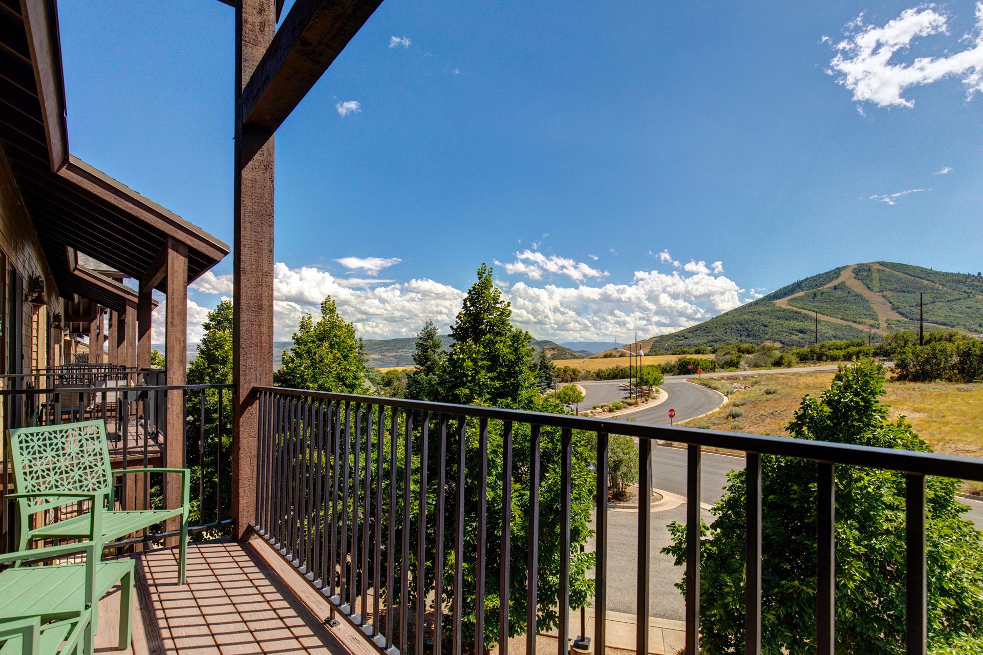 Step outside to your private balcony with seating for two and mountain views in every direction.