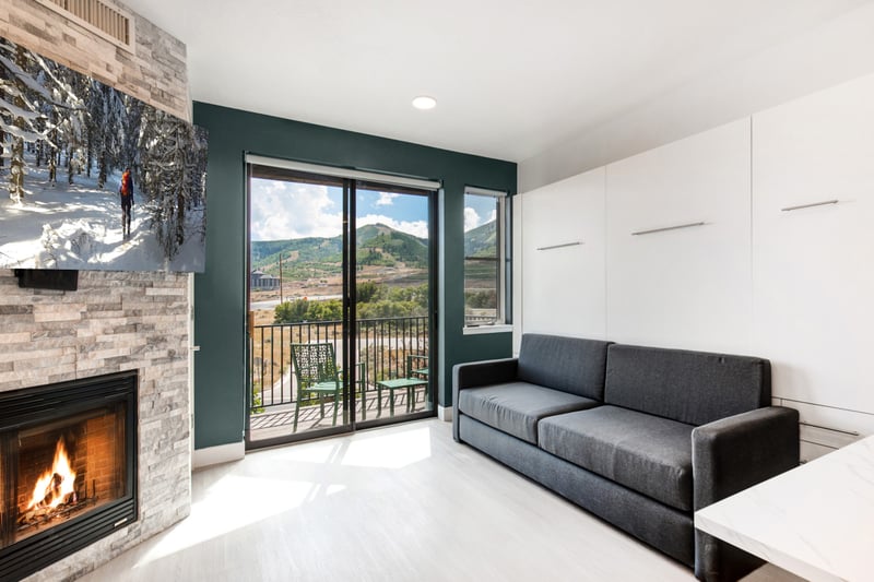 Gather around the fire or take in mountain views from your cozy living area with a sofa and floor-to-ceiling glass doors.