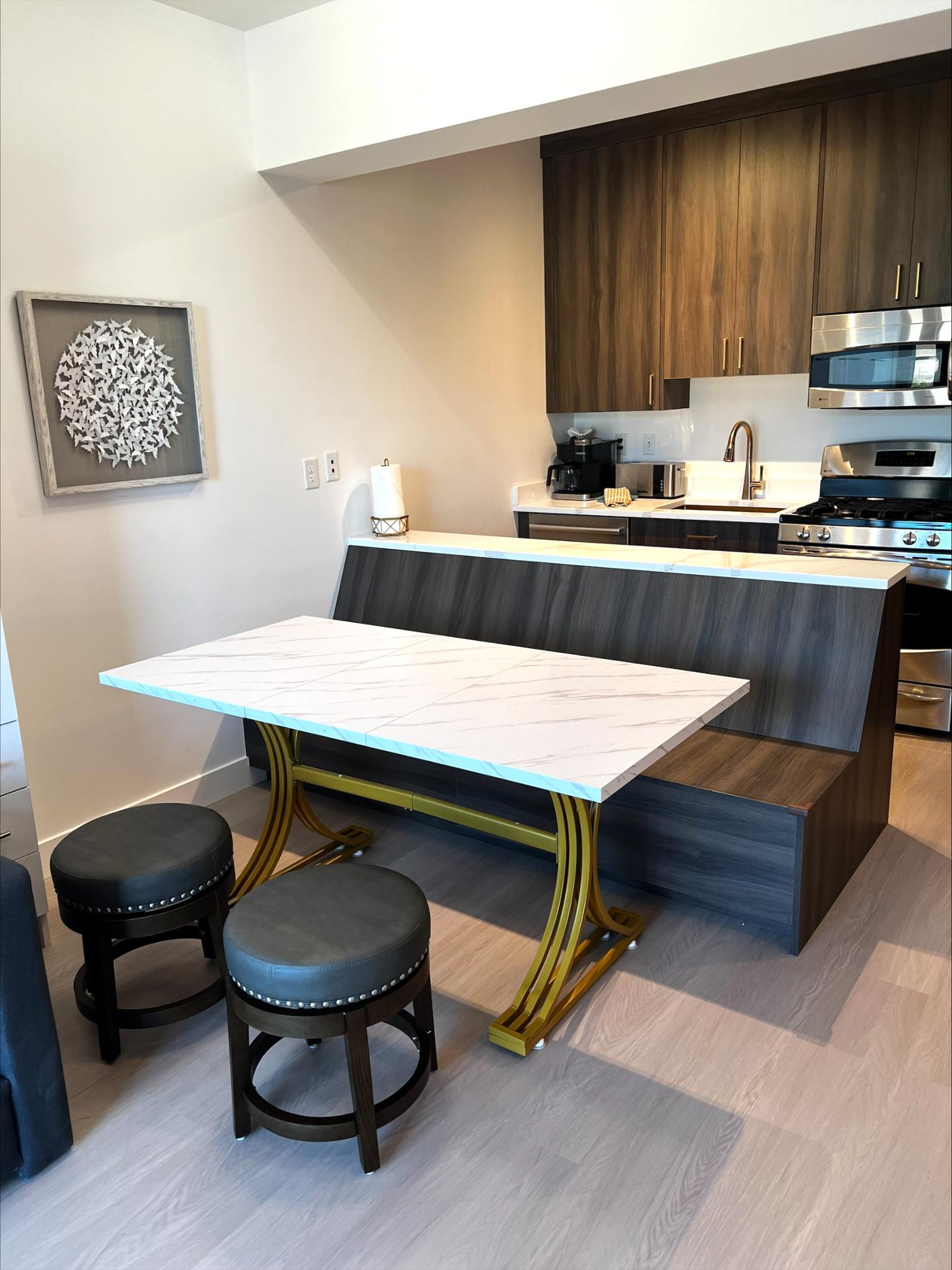 Bring your favorite meals home and gather around this spacious dining table with a bench and stools.