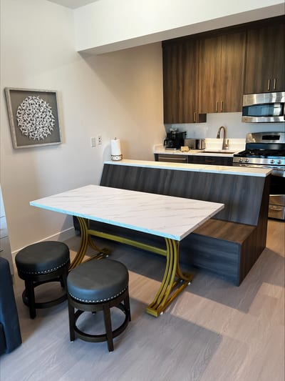 Bring your favorite meals home and gather around this spacious dining table with a bench and stools.