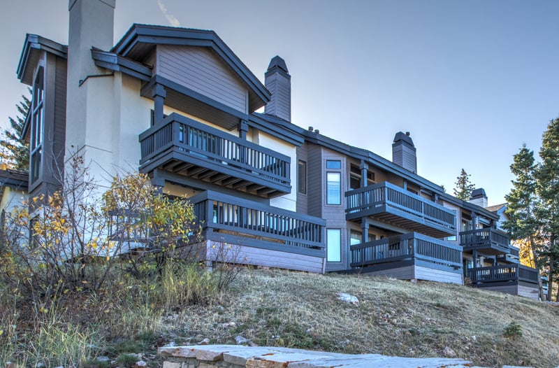 Condo exterior offers direct access to the trailhead and easy walkability.