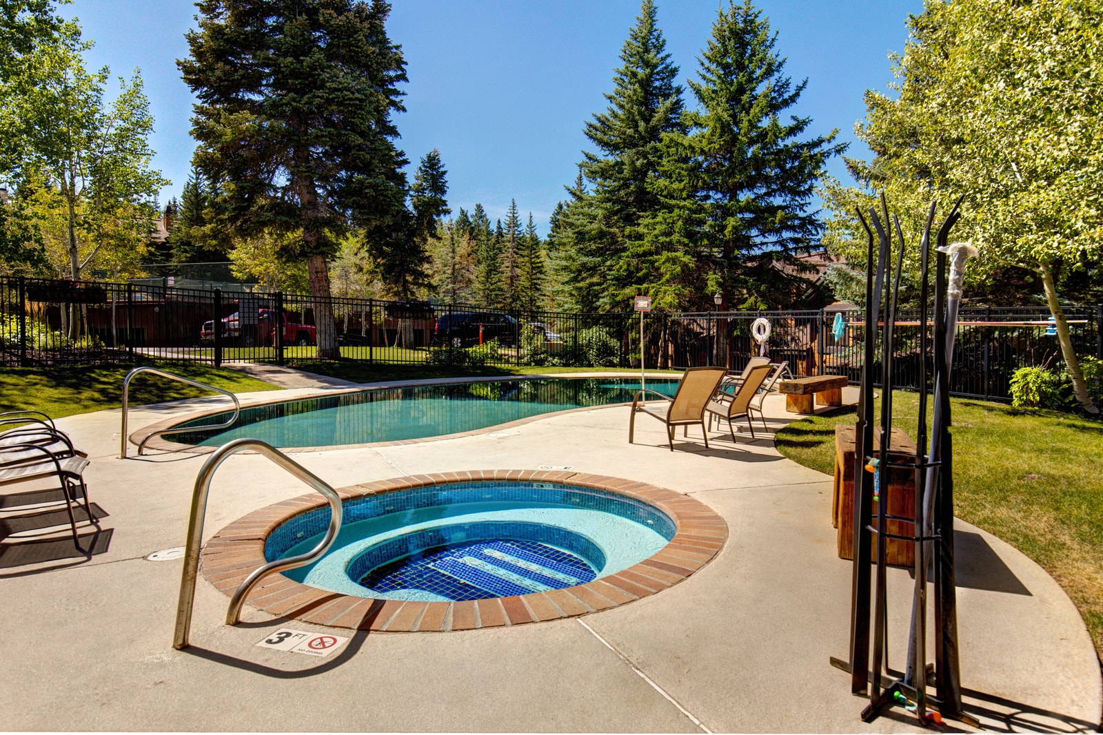 Soak and unwind year-round in the community hot tub surrounded by evergreens.