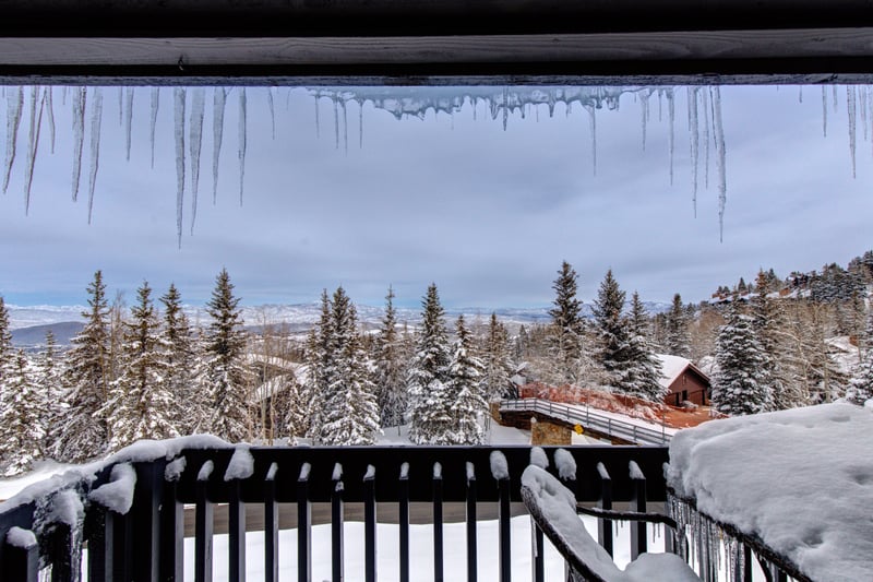 Private balcony offers forest views and fresh alpine air. Ideal for coffee or cocktails.
