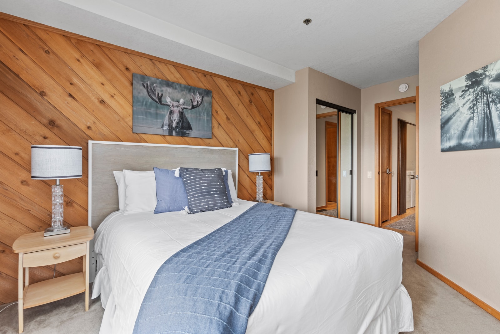 Bedroom 2 features a Queen bed, dresser, and easy access to the shared bath.