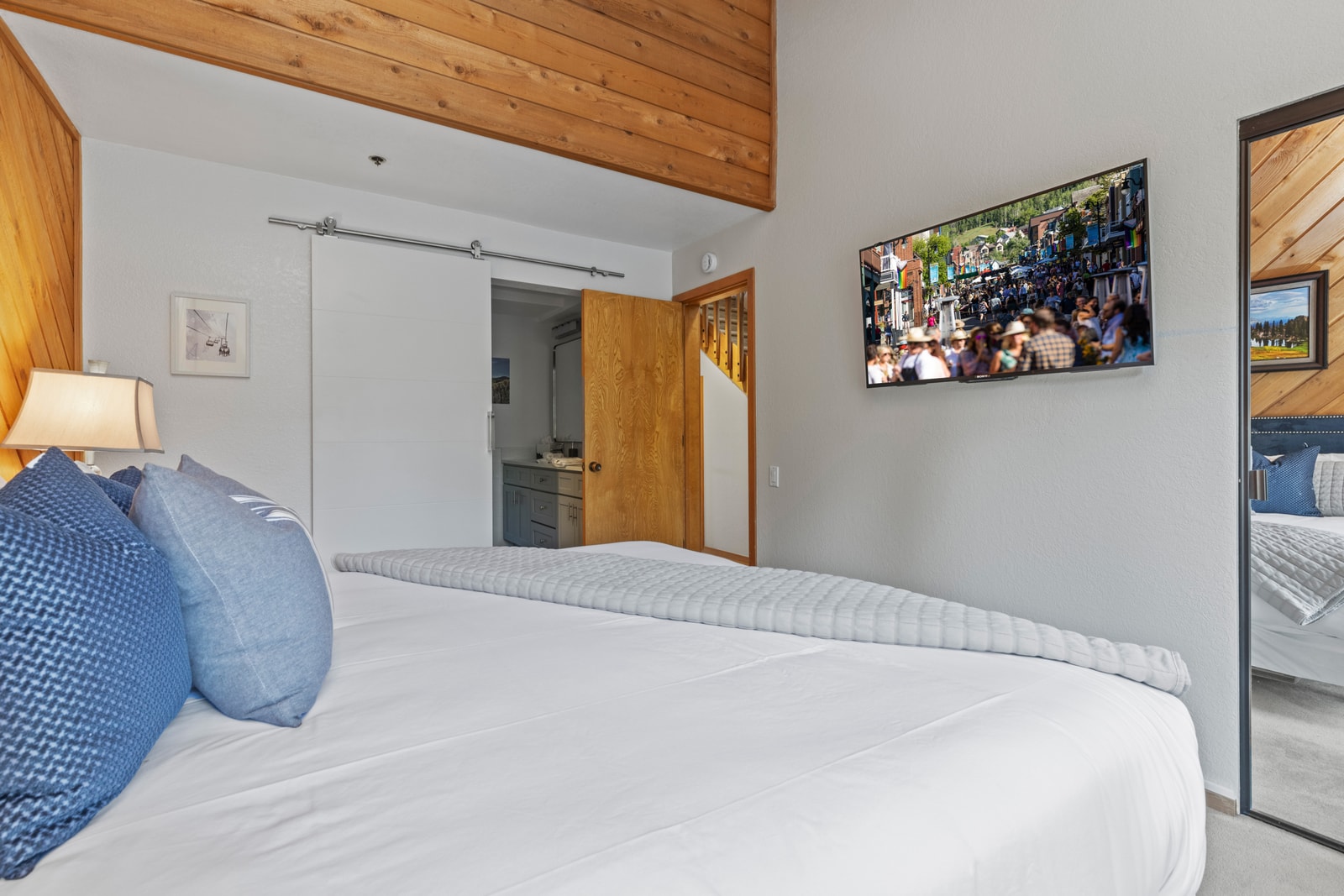 A second angle of the King suite shows natural wood accents and peaceful views.
