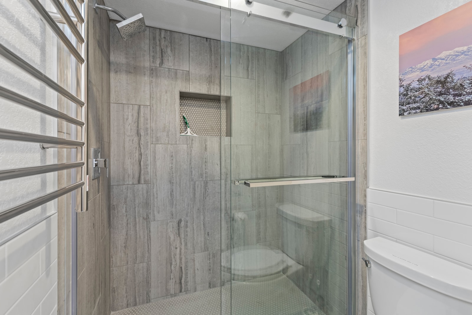 Tile shower and thoughtful touches make this ensuite both stylish and practical.