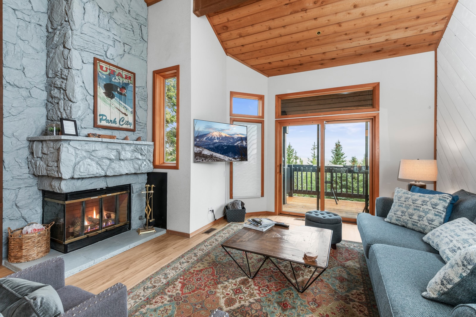 Relax in your cozy living room with vaulted ceilings, gas fireplace, and direct balcony access.