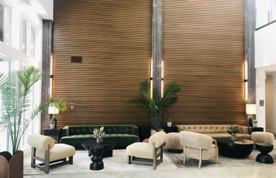 Relax in the elegant lobby at The Mason with soaring ceilings and sophisticated shared spaces.
