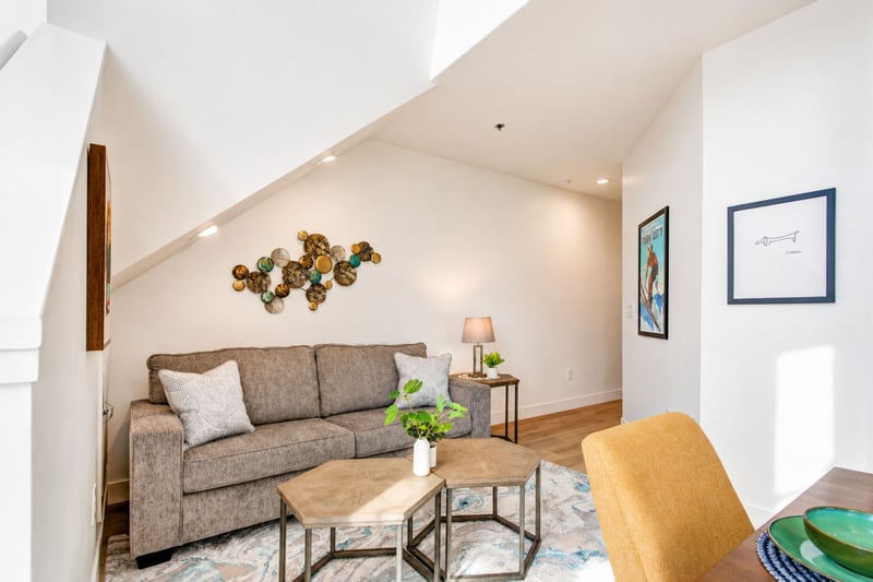 A quiet reading nook tucked beneath the staircase offers a second spot to unwind after a day on the slopes.