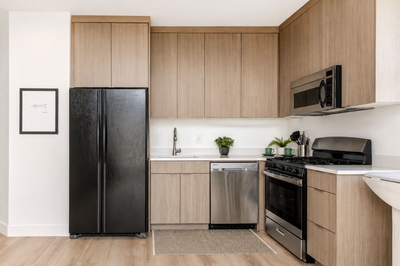 Sleek wood cabinetry and stainless steel appliances make this kitchen as functional as it is stylish.
