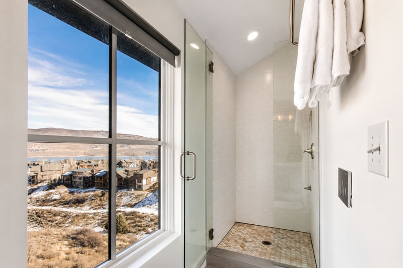 Rinse off with a view: this walk-in shower window frames the surrounding hills through etched glass.