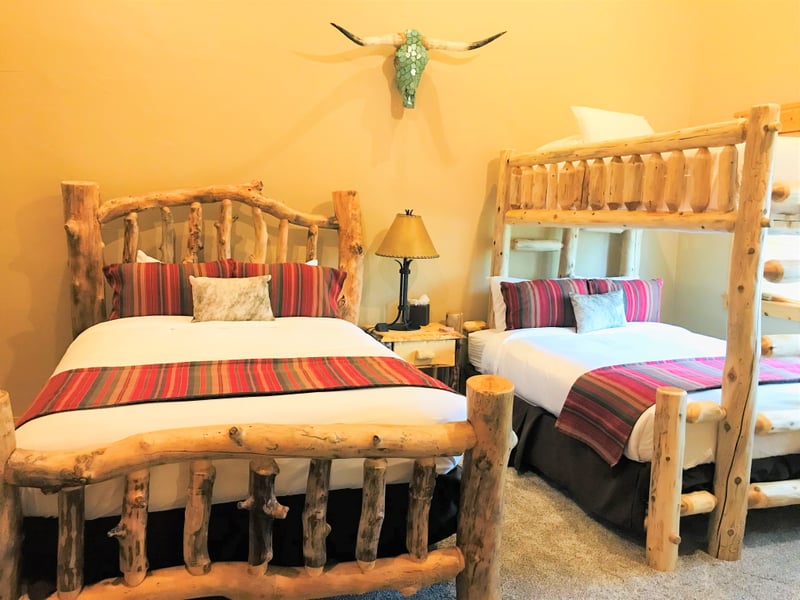 The second bedroom includes flexible space for kids or friends.