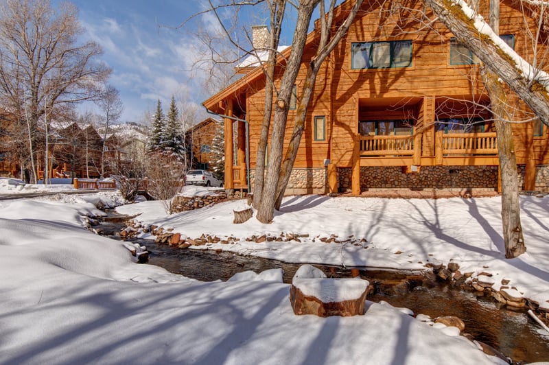 Warm wood siding and classic cabin charm welcome you home at this peaceful alpine retreat.