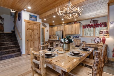 Woven chairs and wood beams offer organic, rustic charm.