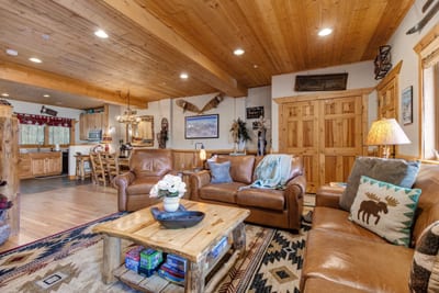 Warm wood finishes and plush seating make the living area ideal for après-ski evenings.