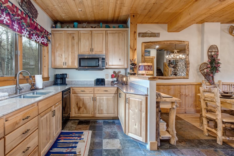Sophisticated finishes meet casual island comfort in this stylish kitchen.