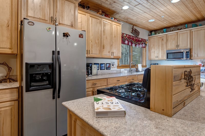 Contemporary kitchen with clean lines and warm wood cabinetry. TWL-5B