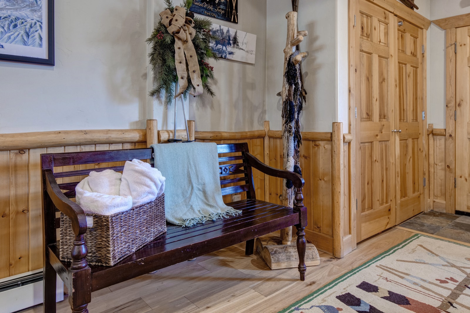 Cozy lodge entryway with rustic bench and warm winter charm. TWL-5B