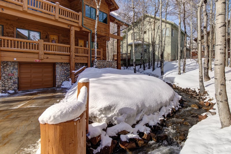 Snowy retreat with garage, beside stream and birch tree grove. TWL-5B