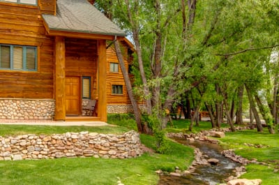 Mature trees and lush landscaping offer a serene, private setting just minutes from town.
