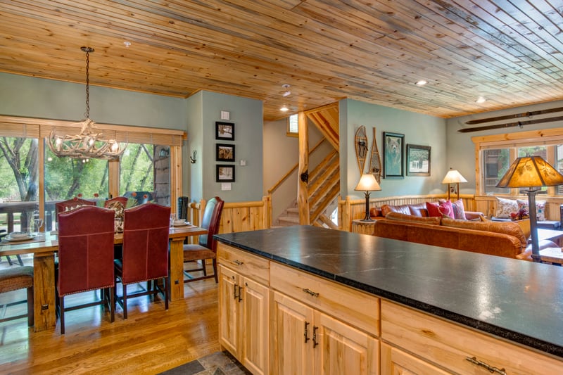 Granite counters and custom cabinetry highlight the fully stocked kitchen for home-cooked meals.