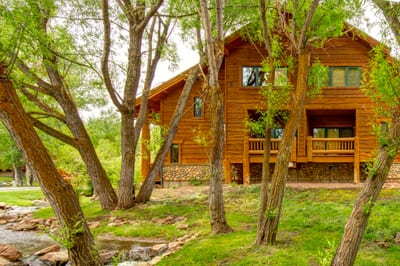 Peek through the trees to a peaceful neighborhood view from your private balcony.