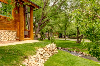 Grassy open space and surrounding trees make this condo feel like a forest hideaway.