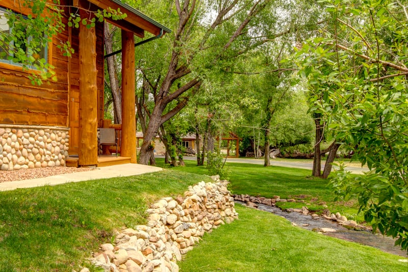 Grassy open space and surrounding trees make this condo feel like a forest hideaway.