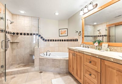 Unwind in your ensuite with walk-in shower, soaking tub, dual vanity, and L’Occitane amenities.
