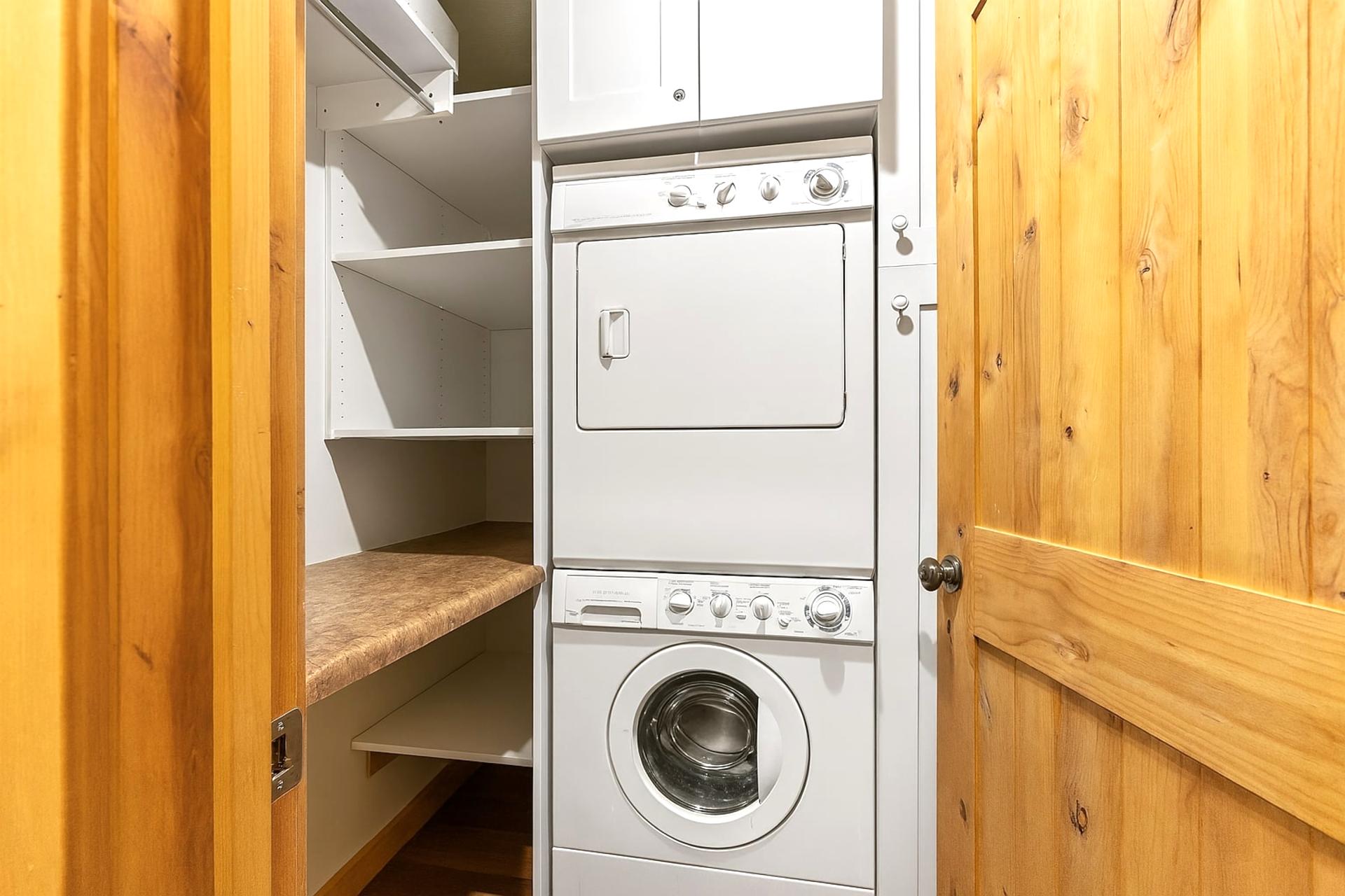 Stacked washer and dryer make laundry easy during longer stays.