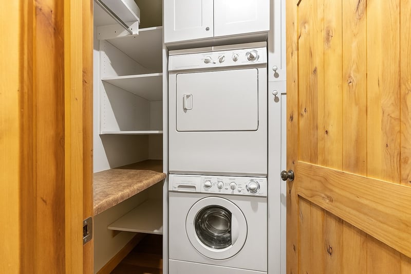 Stacked washer and dryer make laundry easy during longer stays.