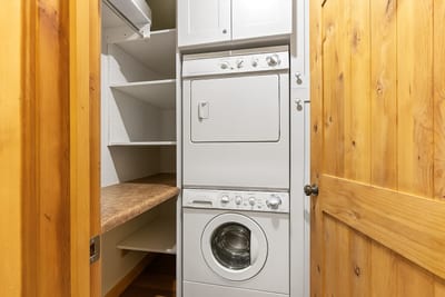 Stacked washer and dryer make laundry easy during longer stays.