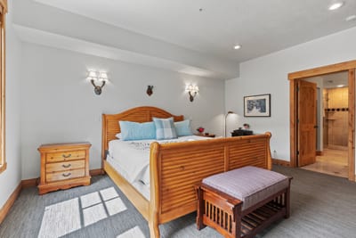 Your spacious primary suite features a King bed, wood furnishings, and private ensuite bath.